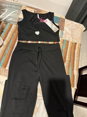 Women’s Black Track Pants & Crop Top Jogger Set with the cuts in pants and shirt
